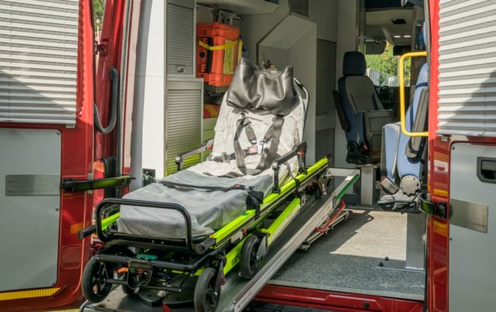 Inside view of a modern emergency ambulance showing a stretcher for patient transport.
